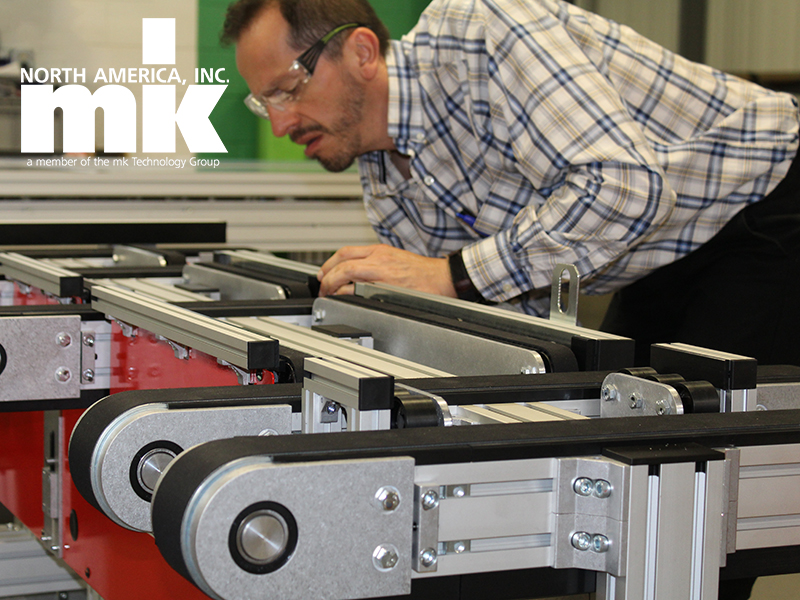 mk North America team member repairing a conveyor