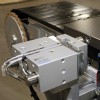 pallet locating device on a covneyor